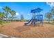 A vibrant, colorful playground with swings, a slide, and plenty of space for to play at 6550 Devesta Loop, Palmetto, FL 34221