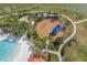 Aerial view showcases the community's playground, pool and other outdoor recreational spaces at 6550 Devesta Loop, Palmetto, FL 34221