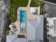Aerial shot of property with pool, spa, lounge area, and manicured backyard at 676 Regatta Way, Bradenton, FL 34208