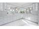 Luxurious bathroom featuring large vanity with cabinets, and reflective mirrors at 676 Regatta Way, Bradenton, FL 34208