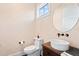 Powder room with stylish decor, vanity, and toilet at 676 Regatta Way, Bradenton, FL 34208
