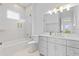 Well-lit bathroom featuring a shower-tub, vanity, and stylish fixtures at 676 Regatta Way, Bradenton, FL 34208