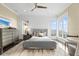 Bright bedroom featuring natural light, hardwood floors, neutral colors, and white trim at 676 Regatta Way, Bradenton, FL 34208