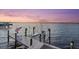Private dock with boat lift offering convenient waterfront access at 676 Regatta Way, Bradenton, FL 34208