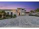 Magnificent two-story home featuring a three-car garage and a spacious paved driveway at 676 Regatta Way, Bradenton, FL 34208