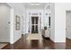 Bright foyer with dark hardwood floors, high ceilings, and elegant decor at 676 Regatta Way, Bradenton, FL 34208