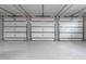 Spacious three-car garage with a clean and organized interior at 676 Regatta Way, Bradenton, FL 34208