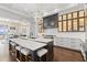 Gourmet kitchen with custom cabinetry, large island and stainless steel appliances at 676 Regatta Way, Bradenton, FL 34208