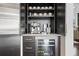 Coffee and beverage station with stainless appliances and custom cabinetry at 676 Regatta Way, Bradenton, FL 34208
