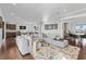 Open-concept living room area with plush seating, pool table and bar at 676 Regatta Way, Bradenton, FL 34208