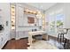 Well-lit office with custom built-ins, chandelier and large window at 676 Regatta Way, Bradenton, FL 34208