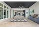 Spacious covered patio with outdoor dining and a built-in grill at 676 Regatta Way, Bradenton, FL 34208