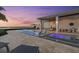 Incredible outdoor space with a stunning pool, spa, outdoor dining area, and water views at 676 Regatta Way, Bradenton, FL 34208