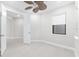 Bedroom with ceiling fan and window overlooking the exterior at 7661 Summerland Cv, Bradenton, FL 34202