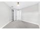 Bright bedroom features neutral carpet and a closet at 7661 Summerland Cv, Bradenton, FL 34202