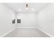 Bright bedroom with neutral carpet, natural light, and minimalist design at 7661 Summerland Cv, Bradenton, FL 34202