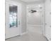 Welcoming entryway with decorative glass door and views into the spacious interior at 7661 Summerland Cv, Bradenton, FL 34202
