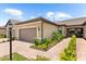 Charming home featuring well-maintained landscaping, a tile roof, and a two-car garage at 7661 Summerland Cv, Bradenton, FL 34202