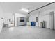 Spacious garage with cabinets, storage and epoxy flooring at 7661 Summerland Cv, Bradenton, FL 34202