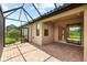 Screened lanai with brick floors featuring multiple access points and natural light, creating an inviting indoor-outdoor space at 7661 Summerland Cv, Bradenton, FL 34202