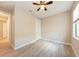 Bedroom boasts tile flooring, ceiling fan, natural light, and a hallway entrance at 7781 Grande Shores Dr, Sarasota, FL 34240