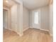 Bright foyer with neutral walls, tile floors, and a decorative glass-paneled front door at 7781 Grande Shores Dr, Sarasota, FL 34240
