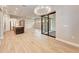 Open-concept living space showcasing kitchen, dining area, and sliding glass doors to the lanai at 7781 Grande Shores Dr, Sarasota, FL 34240