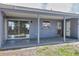 The covered back patio features concrete flooring and a pass-through to the home's interior at 8258 San Jacinto Ave, North Port, FL 34287