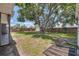 The expansive backyard features mature trees, a fence, and is partially shaded at 8258 San Jacinto Ave, North Port, FL 34287