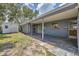 The backyard features a covered back patio and a storage shed, surrounded by greenery at 8258 San Jacinto Ave, North Port, FL 34287