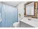 Cozy bathroom with a neutral paint scheme, single sink vanity, and shower at 8258 San Jacinto Ave, North Port, FL 34287