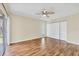 Bright bedroom features wood floors, closet, and sliding doors to the outside at 8258 San Jacinto Ave, North Port, FL 34287