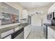 Bright kitchen features white cabinets, stainless steel appliances, granite countertops, and tiled backsplash at 8258 San Jacinto Ave, North Port, FL 34287