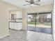 Kitchen with granite countertops, white cabinets, and sliding glass doors to the patio at 8258 San Jacinto Ave, North Port, FL 34287