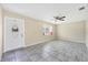 Bright living room features tile flooring, ceiling fan, and window with charming built-in seating at 8258 San Jacinto Ave, North Port, FL 34287