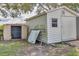 View of the storage shed in the backyard. The shed has a window and a ramp for easy access at 8258 San Jacinto Ave, North Port, FL 34287