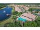 Resort-style community featuring a pool, lake with fountains, and lush landscaping in a desirable location at 8261 Miramar Way # 8261, Lakewood Ranch, FL 34202