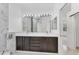 Elegant bathroom with a double vanity and a large mirror, plus a separate commode at 8261 Miramar Way # 8261, Lakewood Ranch, FL 34202