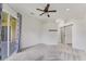 Spacious bedroom featuring a ceiling fan, recessed lighting, and a modern barn door at 8261 Miramar Way # 8261, Lakewood Ranch, FL 34202