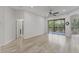 Spacious bedroom featuring a sliding glass door to balcony and ensuite bathroom at 8261 Miramar Way # 8261, Lakewood Ranch, FL 34202