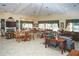 Spacious clubhouse interior with tile floors, multiple seating areas, and large windows for natural light at 8261 Miramar Way # 8261, Lakewood Ranch, FL 34202