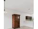 Dining area with a wooden armoire and light wood flooring at 8261 Miramar Way # 8261, Lakewood Ranch, FL 34202