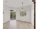 Dining area with natural light from windows and sliding door with wood flooring at 8261 Miramar Way # 8261, Lakewood Ranch, FL 34202