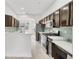Modern kitchen boasts stainless appliances, light countertops, and plenty of cabinet space at 8261 Miramar Way # 8261, Lakewood Ranch, FL 34202
