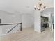 View of the staircase leading to the kitchen and dining area with stainless steel appliances at 8261 Miramar Way # 8261, Lakewood Ranch, FL 34202