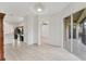 Open living space with wood flooring and sliding glass doors to the outdoor area at 8261 Miramar Way # 8261, Lakewood Ranch, FL 34202
