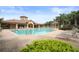 Community pool with ample seating, lounge chairs, a cabana, and easy access to the clubhouse at 8261 Miramar Way # 8261, Lakewood Ranch, FL 34202