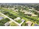 Aerial view showcases the community layout, and surrounding landscape at 8429 Malcolm Ave, North Port, FL 34287