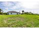 Wide open backyard with lots of grass, perfect for outdoor activities and relaxation at 8429 Malcolm Ave, North Port, FL 34287