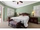 Bright main bedroom with large windows, detailed furniture, and neutral carpet at 8445 Lone Eagle Way, Sarasota, FL 34241